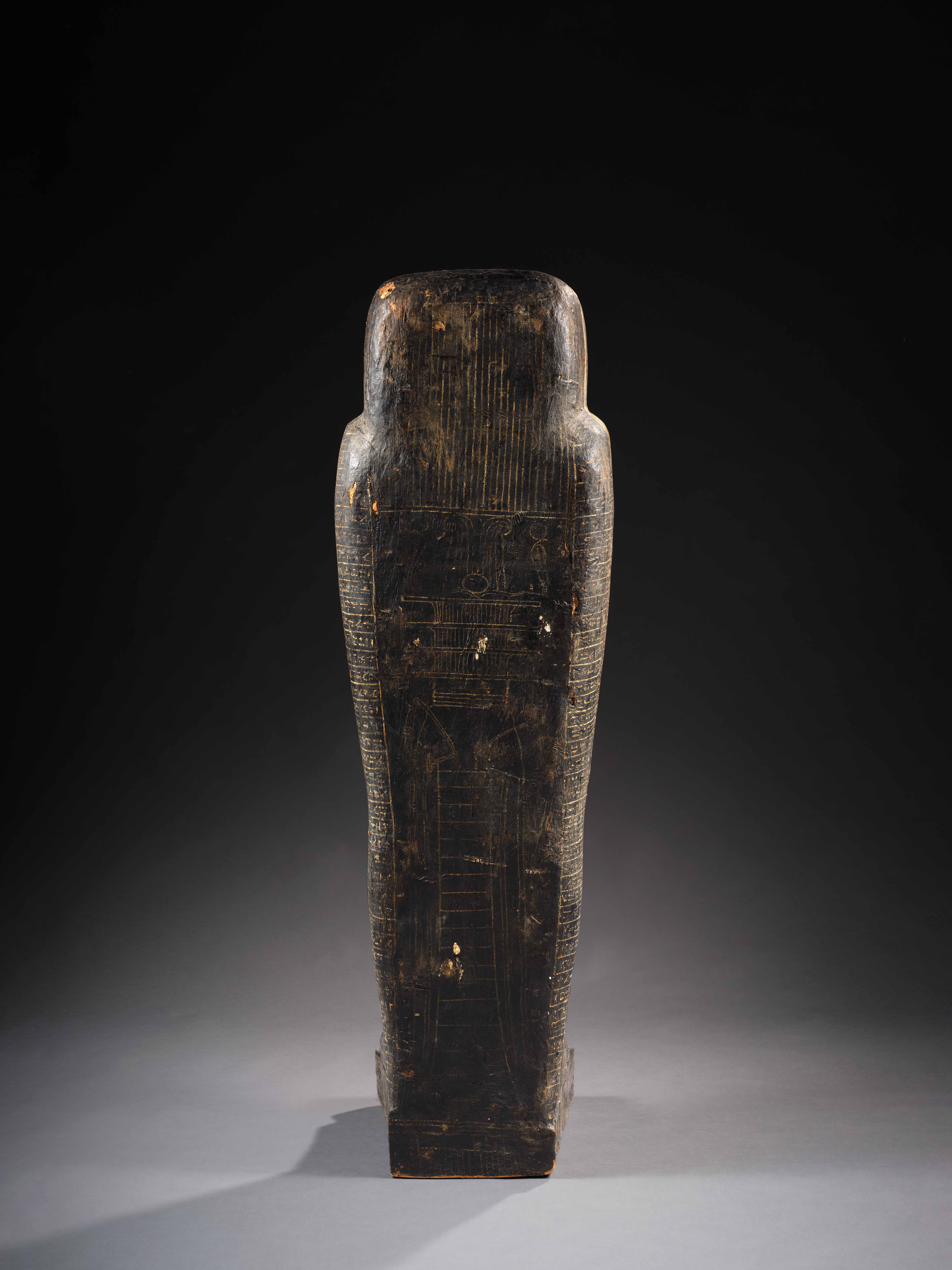 An Egyptian wood inner anthropoid coffin and outer sarcophagus for ...